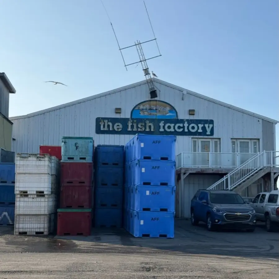 The fish factory building on the Homer Spit with stacked totes out front