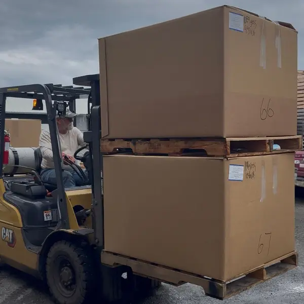 Forklifting totes of frozen sockeye to the container
