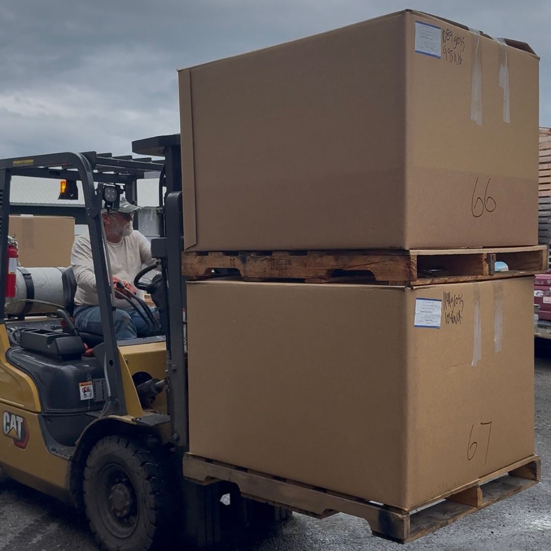 Forklifting totes of frozen sockeye to the container